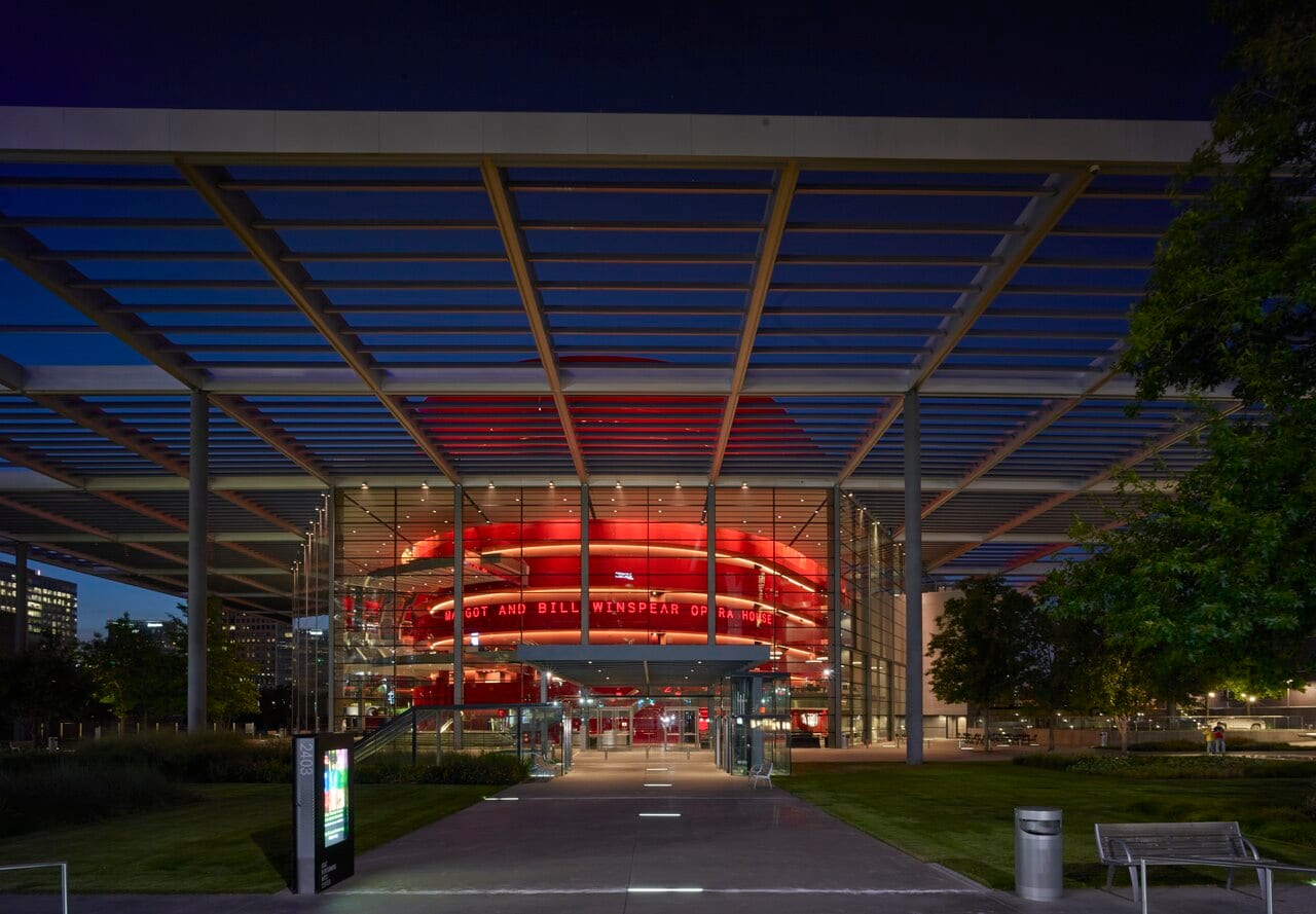 Winspear Opera House at dusk in the Dallas Arts District.